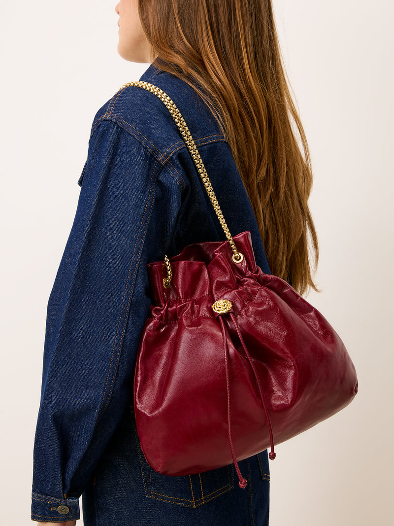 ARTISTE burgundy patent leather purse, detail of gold chain handles by Rouje