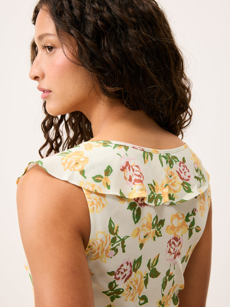 Close-up of the upper back on the Asma sleeveless floral crepe midi dress worn by a model