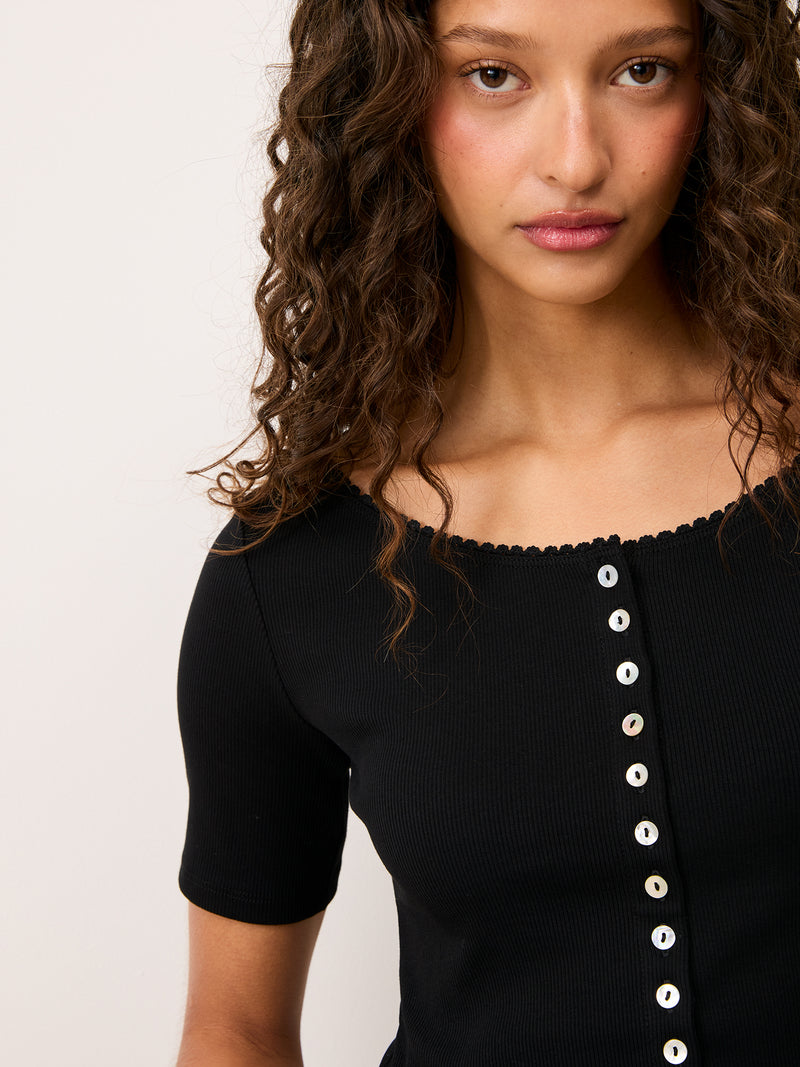 BEATI black cotton long-sleeve cardigan worn on a model by Rouje