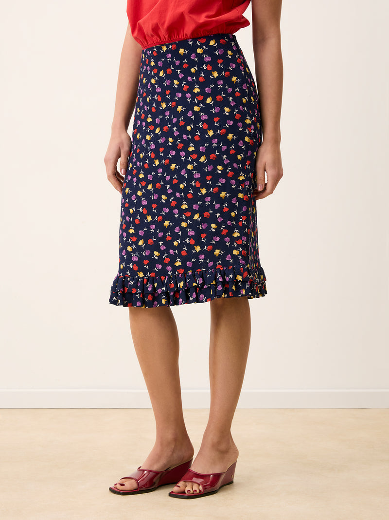 ELIETTE navy tulip print crepe skirt worn on a model by Rouje