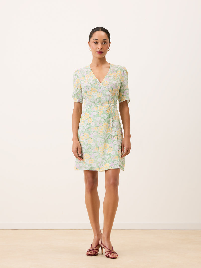 GABINETTE green floral wrap short dress worn on a model by Rouje