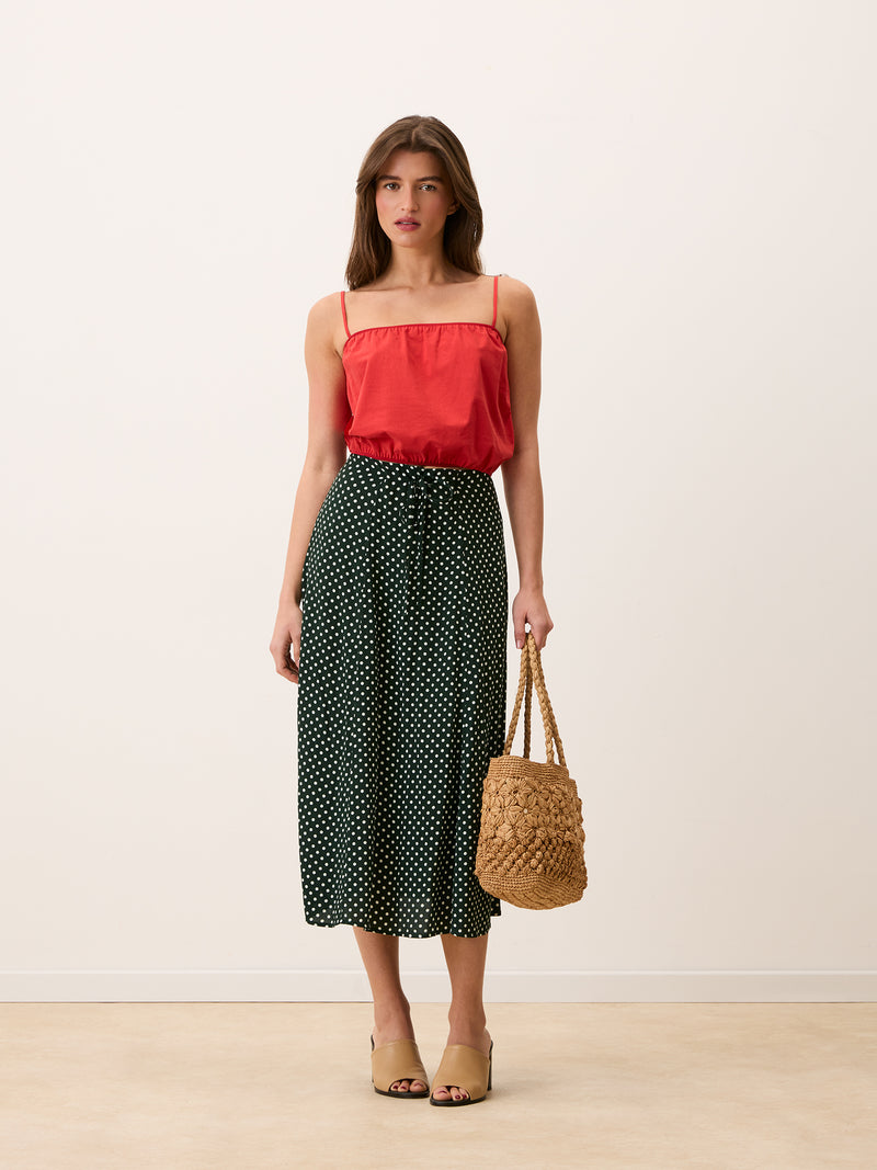 ILONA green polka-dot midi skirt worn on a model by Rouje