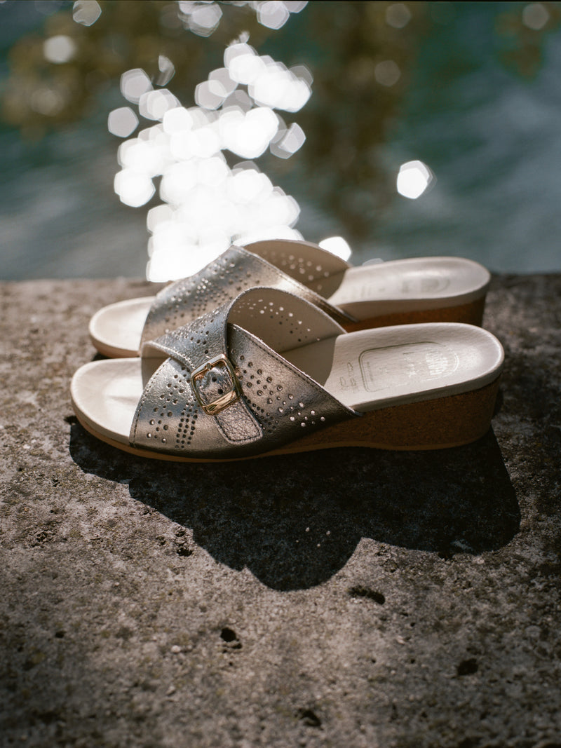 JACQUELINE silver heeled mule shoes staged in a classic, picturesque Parisian setting
