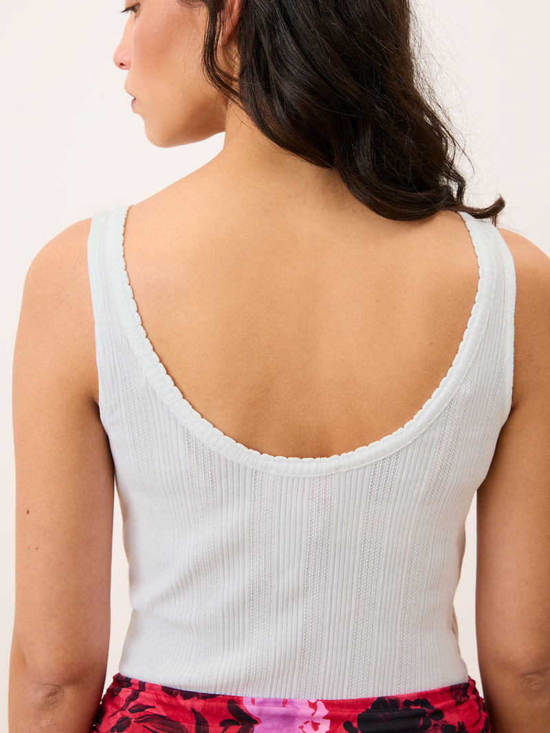 DAMIEN white low-back pointelle top worn on a model by Rouje