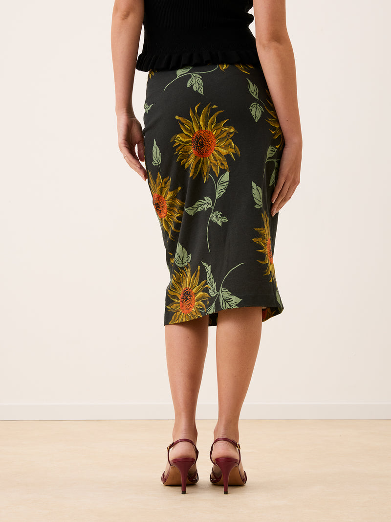 NINOU black sunflower print midi skirt worn on a model by Rouje
