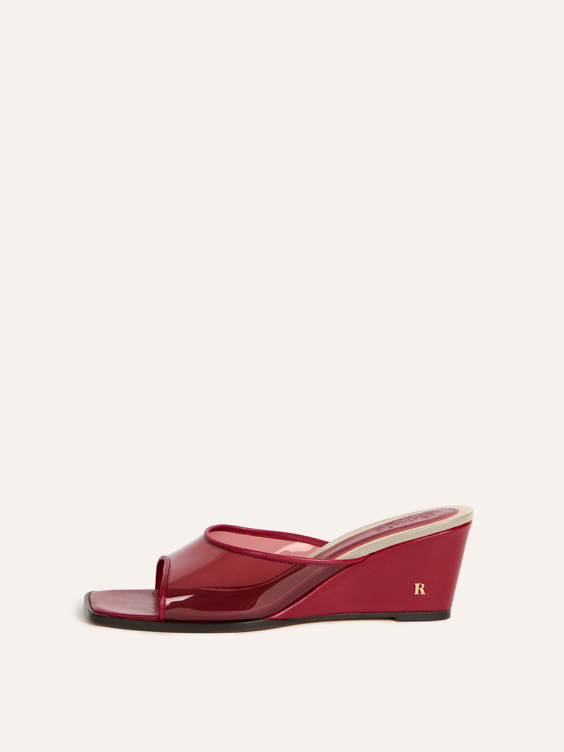 NATTY burgundy vinyl wedge mules, side view by Rouje