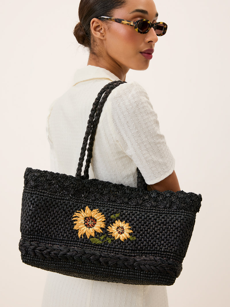 SQUARE black raffia basket bag worn on a model by Rouje
