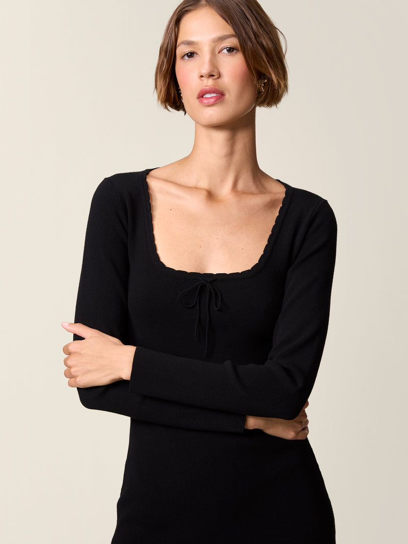 SITA black ruffled short dress, back view by Rouje