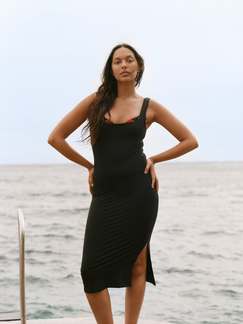 TAMAZA black floral midi dress worn on a model by Rouje