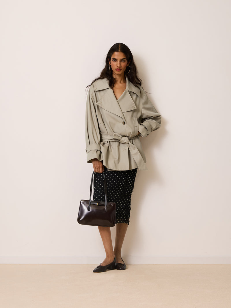 THEODORA putty beige trench coat worn on a model by Rouje