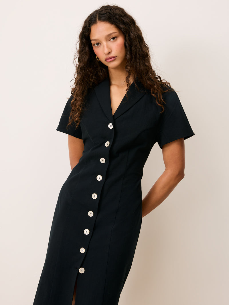 VICTOIRE black cotton midi dress worn on a model by Rouje