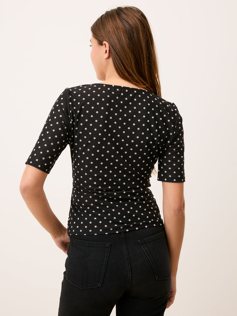 YURA black polka-dot mesh wrap top, back view by Rouje