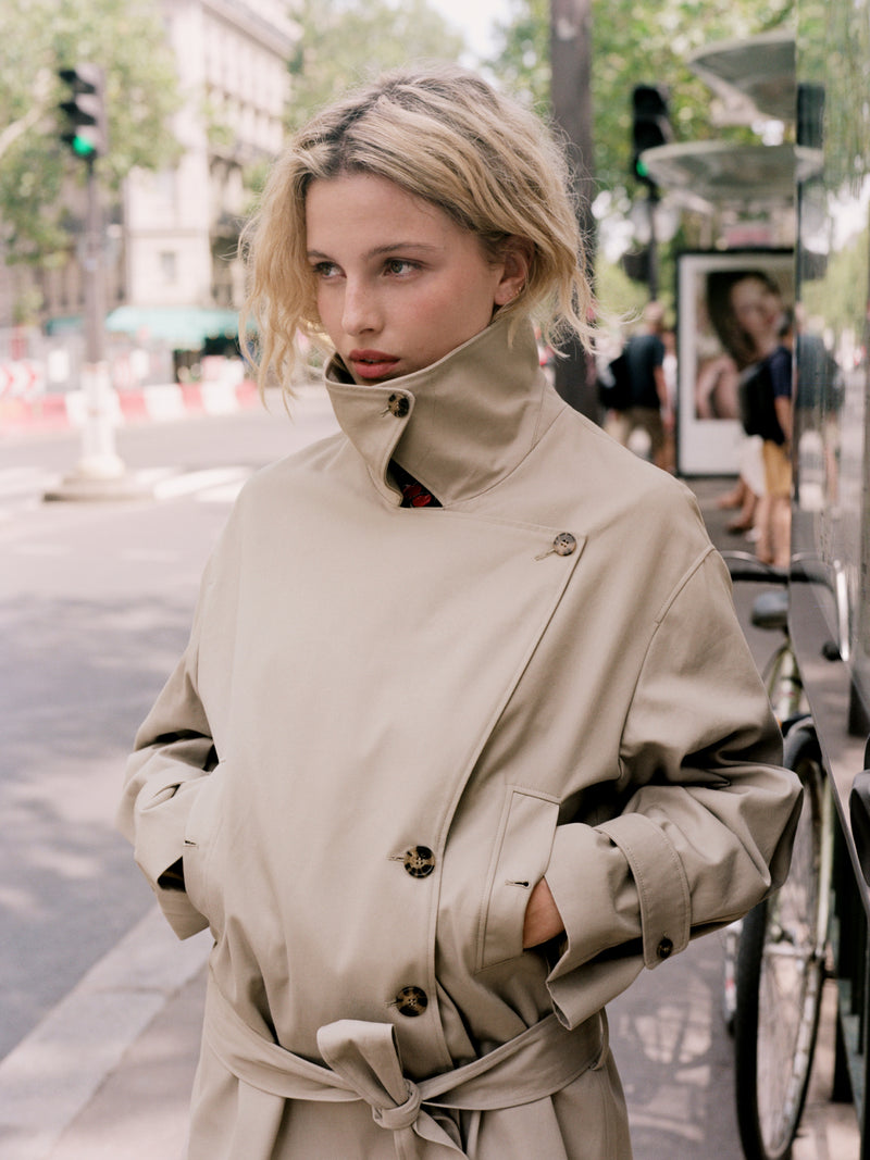 THEODORA putty beige oversized mid-length cotton gabardine trench coat, front view by Rouje